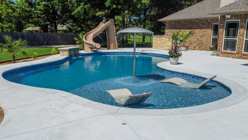 Custom pool with shaded seating area in Fort Smith, Arkansas